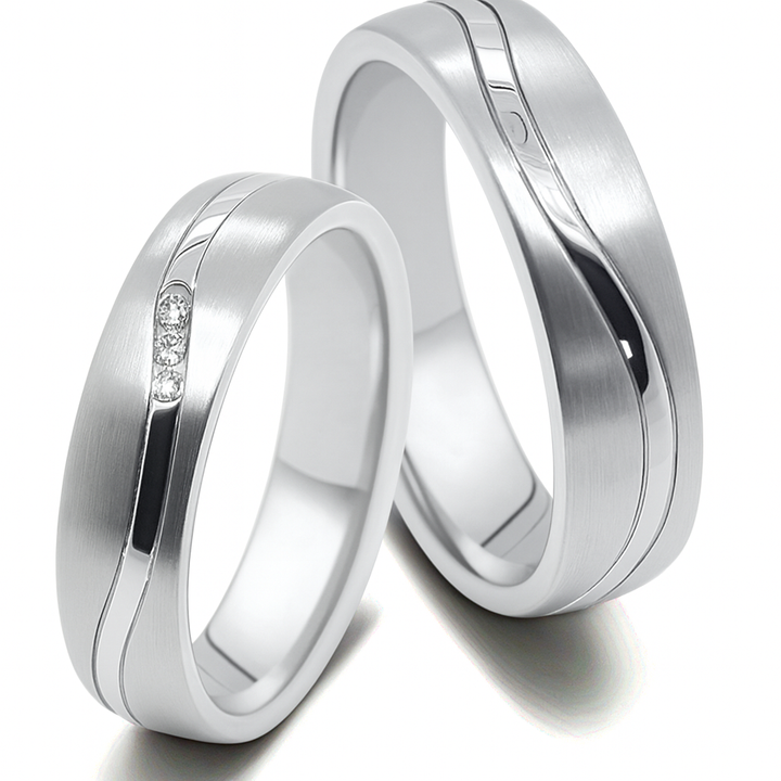 Moderne Partnerringe aus Titan und Edelstahl mit Zirkonia im Damenring